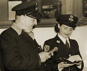 M&MTB tram crew checking the run sheet, circa 1953. Photograph from the Melbourne Tram Museum collection.